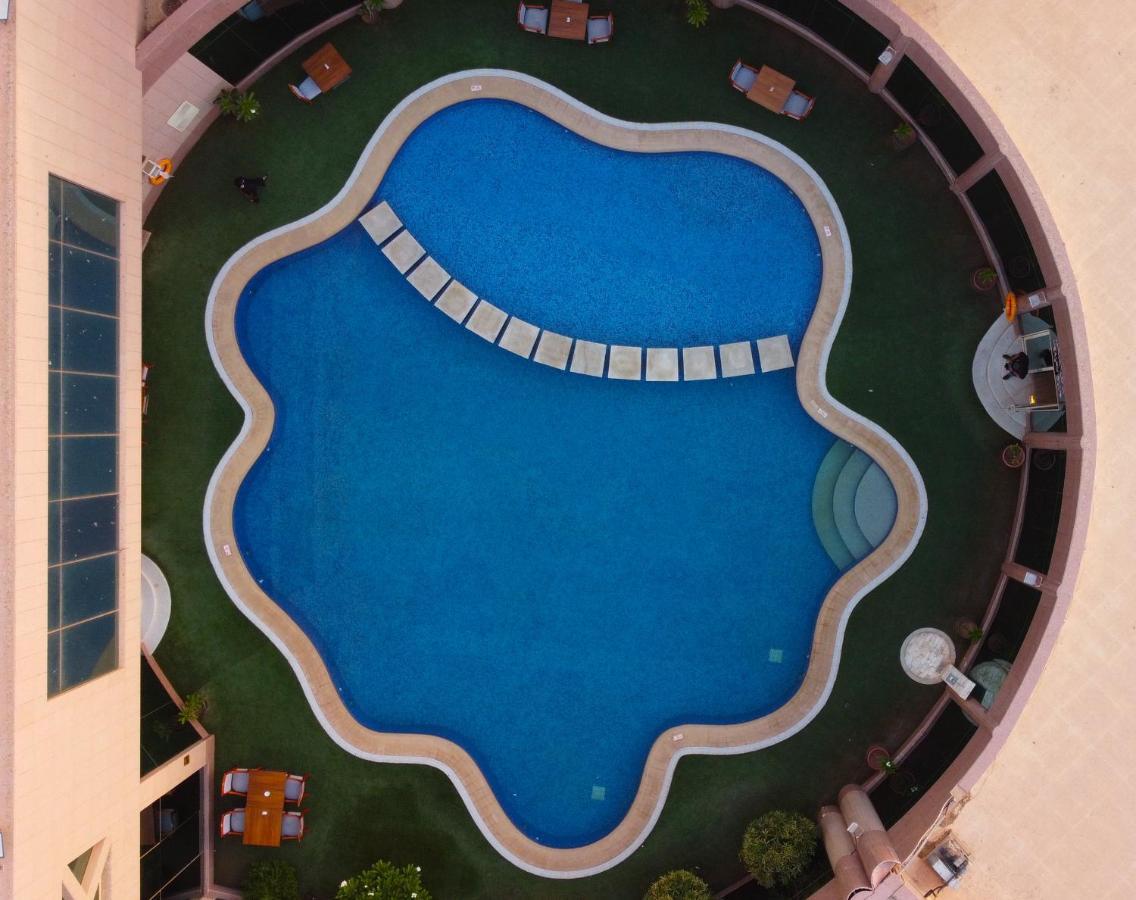 Ramada Hotel & Suites By Wyndham Al Qassim Al Bukayriah Exterior photo Swimming pool at the hotel