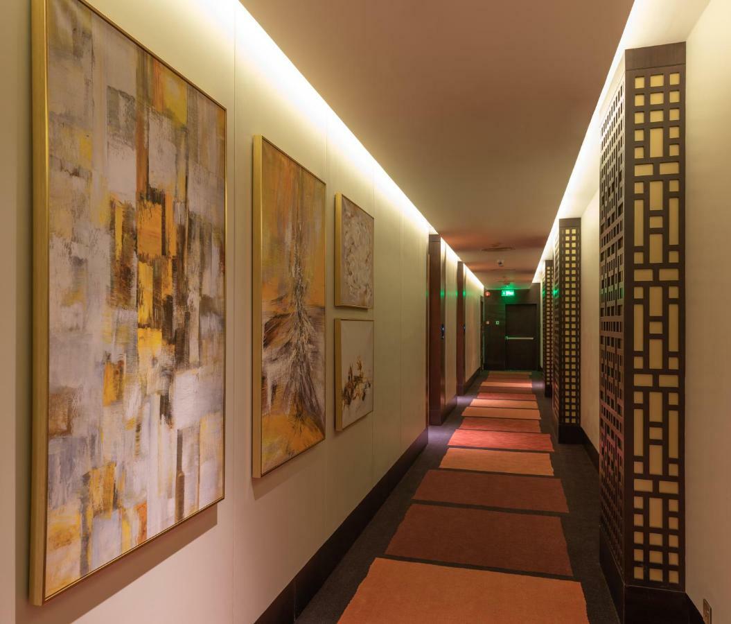 Ramada Hotel & Suites By Wyndham Al Qassim Al Bukayriah Exterior photo A corridor at the hotel